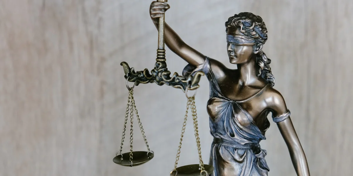 Scales of justice on a wooden desk