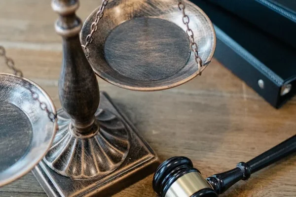 Scales of justice and gavel on desk